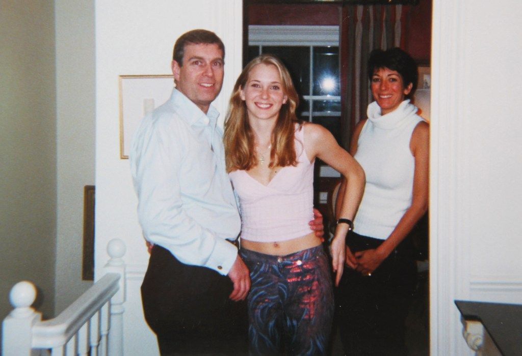 Prince Andrew with his arm around Virginia Giuffre's waist, and Ghislaine Maxwell standing to the right.
