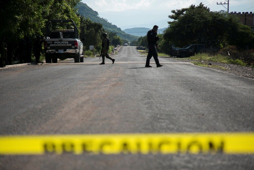Law enforcement at the scene of a police ambush in Aguililla, Michoacán, Mexico.