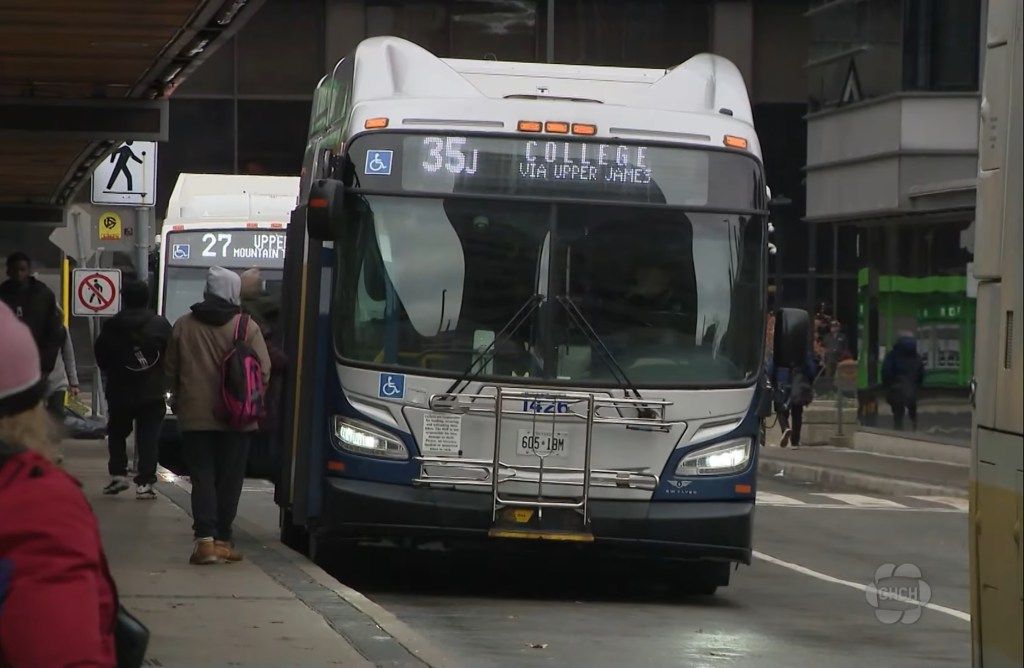 A Hamilton Street Railway city bus at a terminal, displaying 