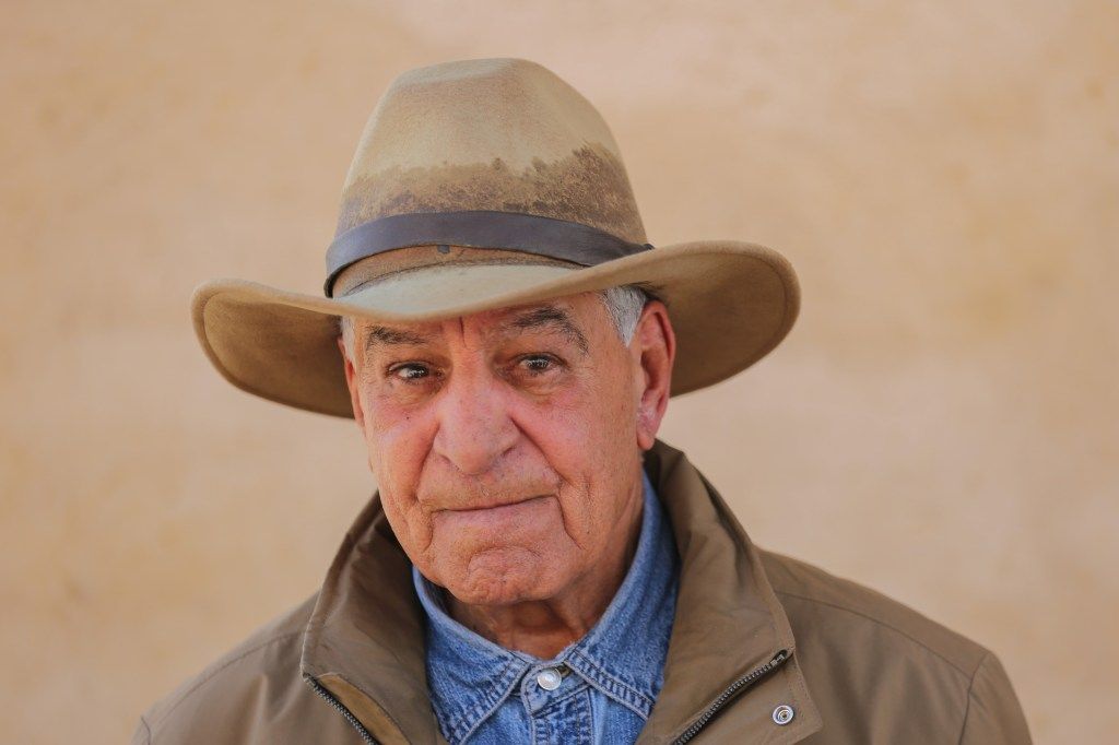 Egyptian archaeologist Zahi Hawass wearing a cowboy hat.