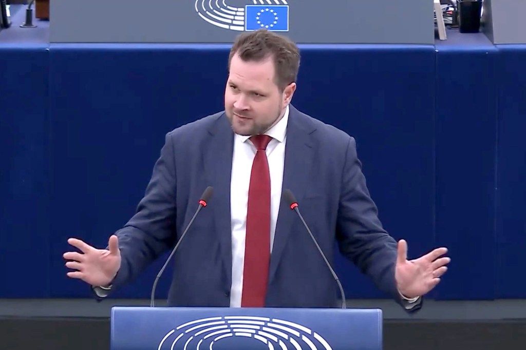 MEP Anders Vistisen speaking at the European Parliament during a debate, gesturing with open hands.