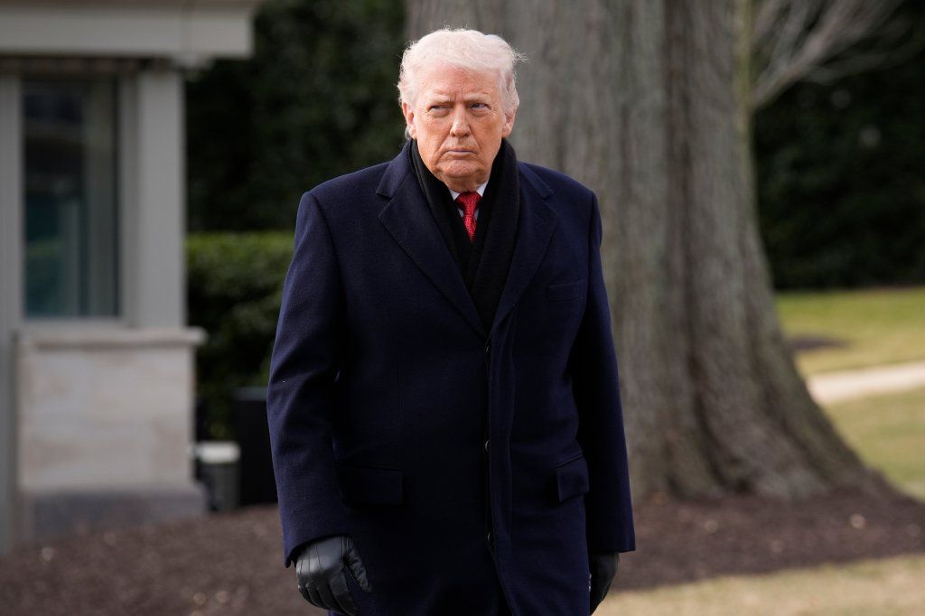 Donald Trump walks on the South Lawn of the White House before boarding Marine One.