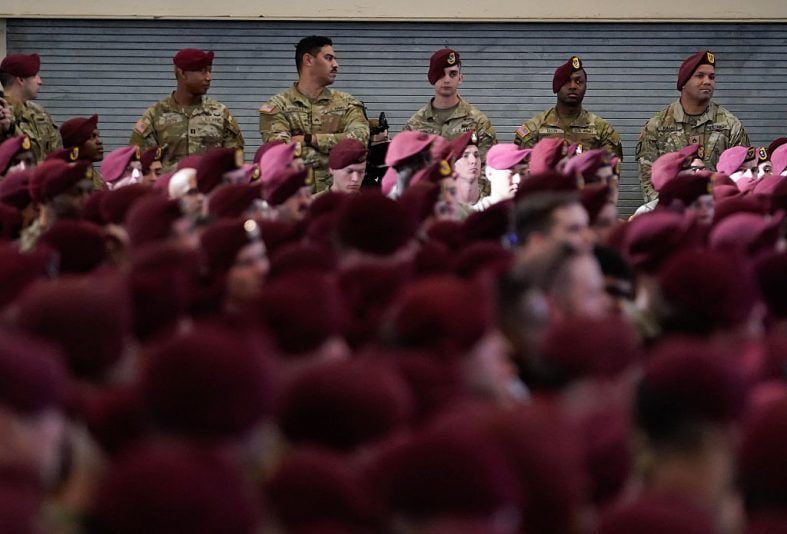 FORT BRAGG, NORTH CAROLINA - FEBRUARY 13: U.S. Army soldiers listen as President Donald Trump speaks during a visit to the Fort Bragg U.S. Army base on February 13, 2026 in Fort Bragg, North Carolina. Trump visited the base to honor special forces involved in the military operation in Venezuela in early 2026. (Photo by Nathan Howard/Getty Images)