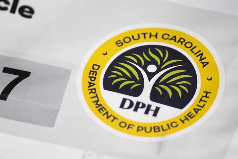 SPARTANBURG, SOUTH CAROLINA - FEBRUARY 6: A logo on a sign from the South Carolina Department of Public Health at a mobile clinic offering free measles vaccinations on February 6, 2026 in Spartanburg, South Carolina. The clinic offered vaccinations as the South Carolina Department of Health reported 876 cases of measles earlier in the week, most centered in Spartanburg County. (Photo by Sean Rayford/Getty Images)