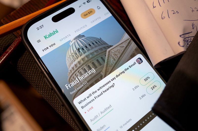 CHICAGO, ILLINOIS - FEBRUARY 25: In this photo illustration, An app for Kalshi, an online prediction market site, is shown on February 25, 2026 in Chicago, Illinois. Online prediction market platforms allow people to place bets on wide-ranging subjects such as sports, finance, politics and currents events. (Photo Illustration by Scott Olson/Getty Images)
