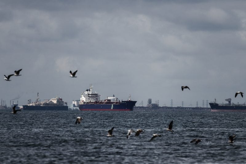 This photograph shows the Bunkering Tanker GAS VITALITY (L) and the Oil and Chemical Tanker HAFNIA MAGELLAN waiting in the Grand Port Maritime de Marseille-Fos with the DPF "Depot Petrolier de France" in the background in Fos-sur-Mer, off the Mediterranean coast of southern France on March 11, 2026. The 32 member countries of the International Energy Agency (IEA) decided on March 11, 2026 to unlock 400 million barrels of oil from their reserves -- the biggest such release ever -- to ease the impact of the Middle East war. (Photo by Thibaud MORITZ / AFP via Getty Images)
