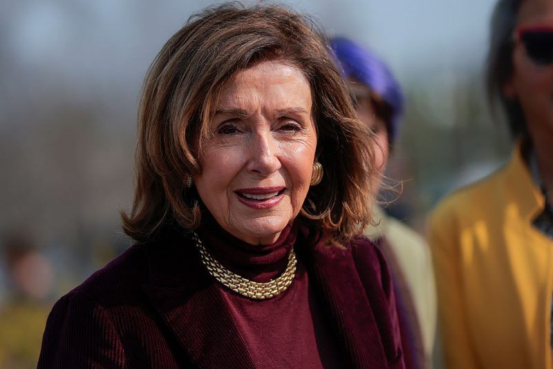 WASHINGTON, DC - MARCH 26: U.S. Rep. Nancy Pelosi (D-CA) (L) speaks about the continued fight for women to be receive equal pay for equal work at the House Triangle outside the U.S. Capitol on March 26, 2026 in Washington, DC. Members of the Democratic Women's Caucus gather to continue demanding action to end the wage gap on "equal pay day." (Photo by Heather Diehl/Getty Images)