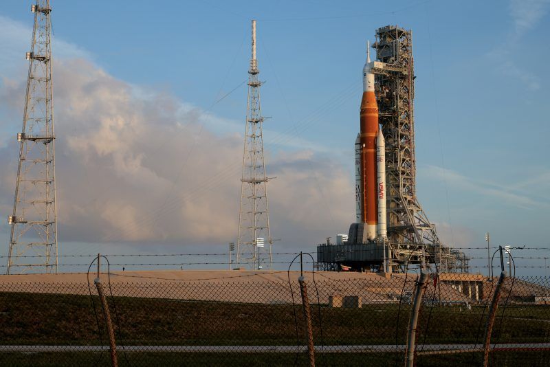 CAPE CANAVERAL, FLORIDA - MARCH 31: NASA's 322-foot-tall Artemis II Space Launch System rocket and Orion spacecraft stand on Launch Complex 39B at Kennedy Space Center on March 31, 2026 in Cape Canaveral, Florida. The 10-day mission will take NASA astronauts Commander Reid Wiseman, Pilot Victor Glover and Mission Specialist Christina Koch and CSA (Canadian Space Agency) Mission Specialist Jeremy Hansen around the moon and back. The astronauts are supposed to fly 230,000 miles out into space, the farthest any human has ever traveled from Earth. (Photo by Chip Somodevilla/Getty Images)