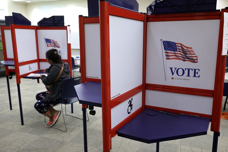 BURKE, VIRGINIA - APRIL 17: A voter casts a ballot during early voting at a polling place on April 17, 2026 in Burke, Virginia. Virginia voters will decide on April 21 a statewide ballot question on whether to allow the Virginia General Assembly to redraw congressional districts which could affect how the state’s U.S. House districts are mapped in upcoming elections and shift political balance. (Photo by Alex Wong/Getty Images)