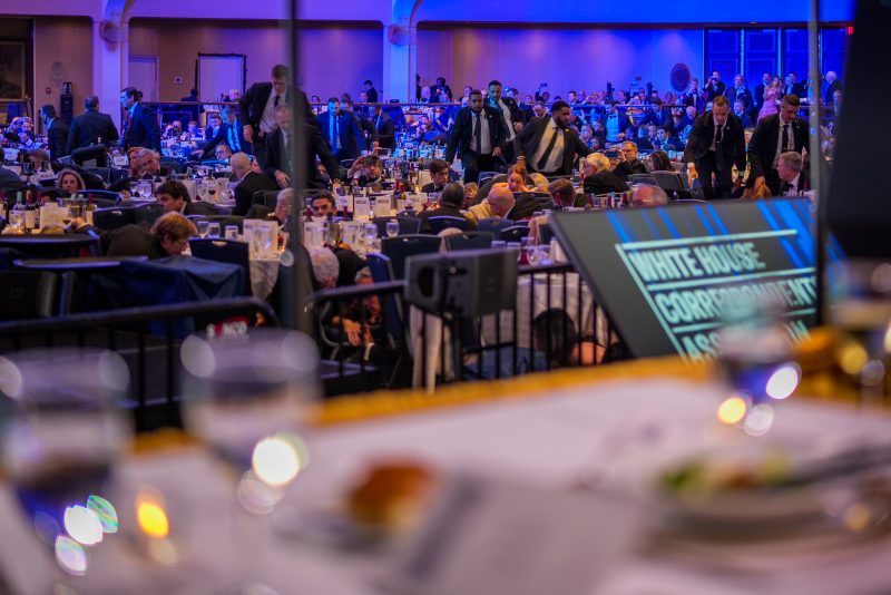 WASHINGTON, DC - APRIL 25: Secret Service agents move across the ballroom during a shooting incident at the annual White House Correspondents Association Dinner at the Washington Hilton on April 25, 2026 in Washington, DC. According to reports, President Donald Trump, along with other government officials, were evacuated from the Washington Hilton gun shots. (Photo by Andrew Harnik/Getty Images)