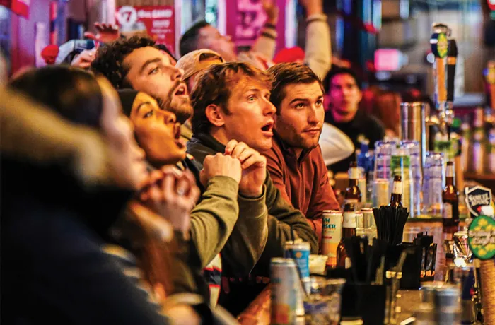 Fans watch Super Bowl LX at the sports bar, Saloon, on Feb. 8, 2026, in Boston. (Finn Gomez/The Boston Globe via Getty Images)