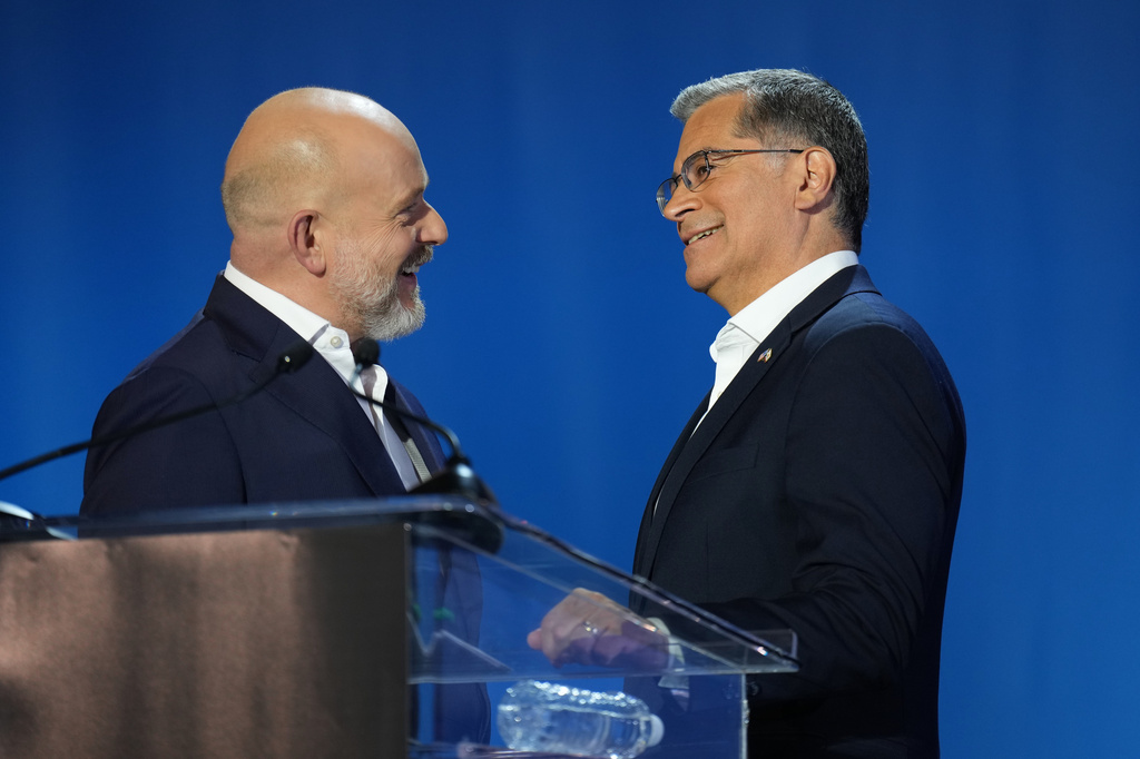 Steve Hilton, left, and Xavier Becerra speak during a break in a California gubernatorial debate hosted by CBS LA at Pomona College in Claremont, Calif., Tuesday, April 28, 2026.