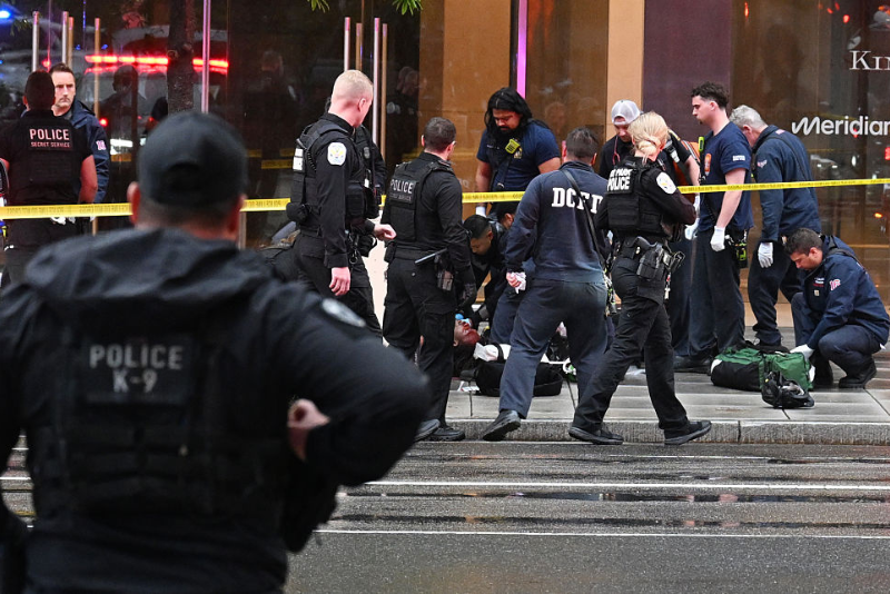 Members of the U.S. Secret Service tend to a wounded man on the scene of a shooting near the White House on May 23, 2026 in Washington, DC. Emergency teams work the scene after multiple rapid-fire gunshots ring out outside the White House. President Trump was reportedly inside the White House working on a peace deal with Iran. (Photo by Roberto Schmidt/Getty Images)