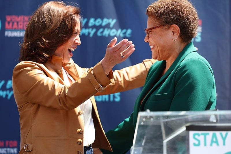 LOS ANGELES, CALIFORNIA - APRIL 15: U.S. Vice President Kamala Harris (L) prepares to embrace Los Angeles Mayor Karen Bass during a surprise appearance at the March for Reproductive Rights organized by Women’s March L.A. on April 15, 2023 in Los Angeles, California. The march was organized in response to a Texas federal judge’s ruling to rescind FDA approval of the abortion pill Mifepristone. (Photo by Mario Tama/Getty Images)