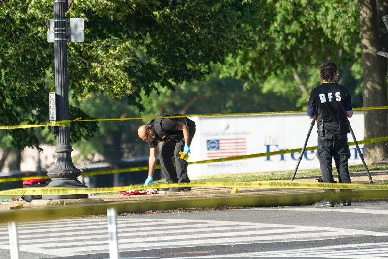 WASHINGTON, DC - MAY 04: Crime scene technicians catalog evidence following an exchange of gunfire by the U.S. Secret Service and a gunman on the National Mall on May 4, 2026 in Washington, DC. Police say a gunman shot at a Secret Service agent and wounded a bystander before being shot by police. (Photo by Andrew Leyden/Getty Images)