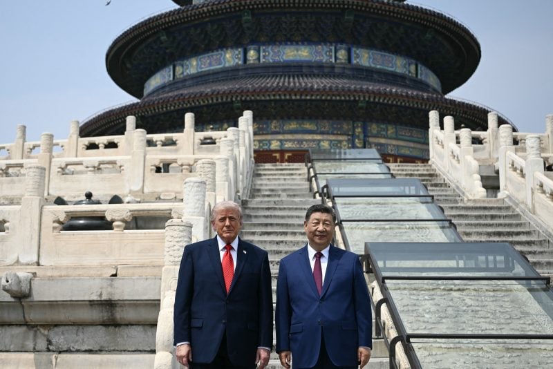 China's President Xi Jinping (R) and US President Donald Trump pose for a photo at the Temple of Heaven in Beijing on May 14, 2026. Xi warned Trump that the issue of Taiwan could push their two countries into "conflict" if mishandled, a stark opening salvo as a superpower summit set to tackle numerous thorny issues began in Beijing on May 14. (Photo by Brendan SMIALOWSKI / POOL / AFP via Getty Images)