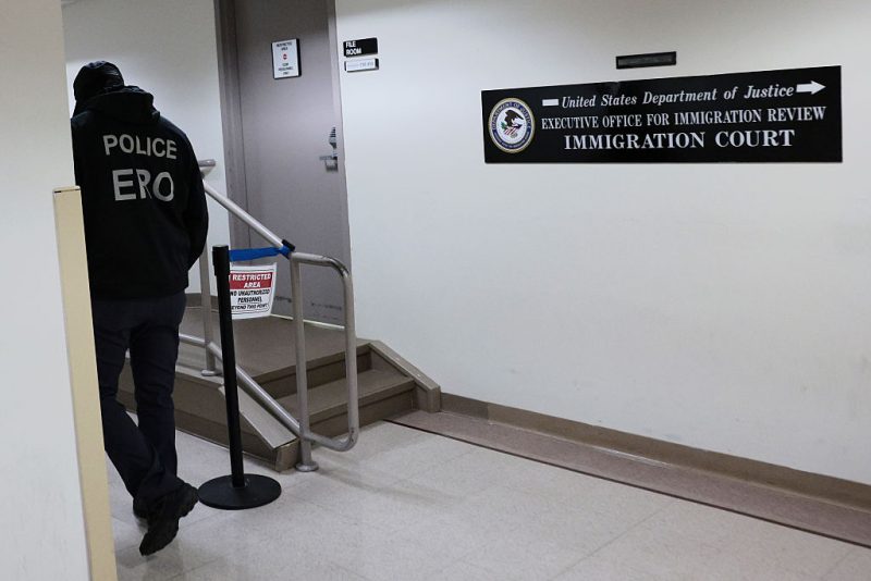 NEW YORK, NEW YORK - MAY 12: Masked federal agents patrol the halls of immigration court at Jacob K. Javits Federal Building on May 12, 2026 in New York City. Immigration and Customs Enforcement (ICE) agents continue to have a presence in immigration courts in federal buildings which allow them to wear masks despite a new state law that bans federal law enforcement agents, including ICE, from wearing masks or balaclavas in public spaces to cover their faces. (Photo by Michael M. Santiago/Getty Images)