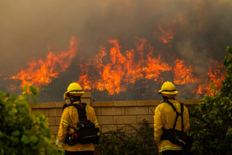 Fire fighters monitor the Sandy Fire as it burns in the hills close to a residential area in Simi Valley, California, on May 18, 2026. About 24,000 people in Simi Valley, 40 miles northwest of Los Angeles, are under mandatory evacuation orders as the Sandy Fire is "spreading dangerously fast" according to fire officials. (Photo by Apu GOMES / AFP via Getty Images)