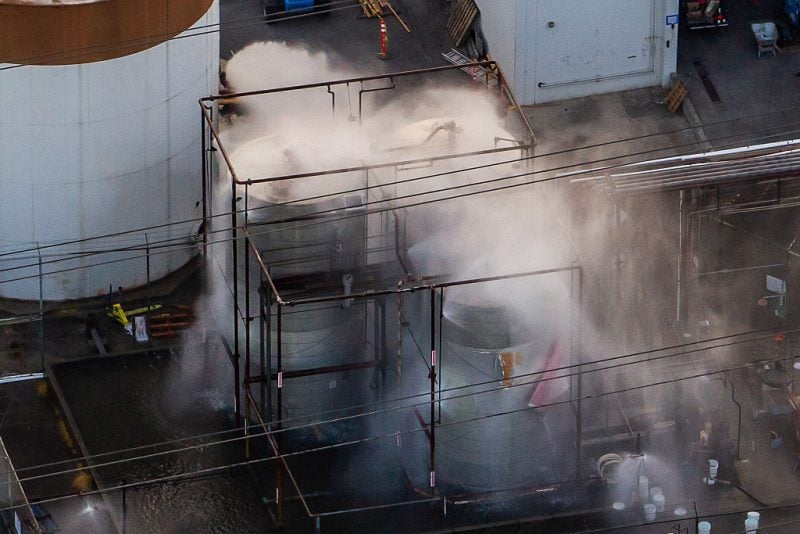 GARDEN GROVE, CALIFORNIA - MAY 23: An aerial view of water being sprayed onto an overheated 34,000-gallon tank at GKN Aerospace on May 23, 2026 in Garden Grove, California. A malfunctioning tank at an aerospace plant has the potential of a chemical leak or explosion. An incident at GKN Aerospace, a manufacturer of components for commercial and military aircraft, triggered the facility's automatic sprinkler system. Investigators are expected to examine the cause of the hazardous leak once the site has been fully stabilized. (Photo by Apu Gomes/Getty Images)