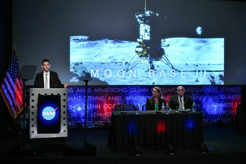 NASA Administrator Jared Isaacman speaks during a news conference at NASA headquarters in Washington, DC, on May 26, 2026, to outline plans for NASA's "Moon Base" lunar base and progress toward a sustained human presence on the Moon. Also pictured, L/R, are Lori Glaze, acting associate administrator, Exploration Systems Development Mission Directorate, and Carlos Garcia-Galan, Moon Base program executive. (Photo by Mandel NGAN / AFP via Getty Images)