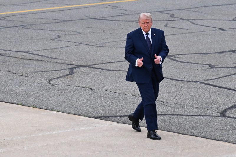 MORRISTOWN, NEW JERSEY - MAY 22: U.S. President Donald Trump gestures toward members of the media as he walks to board Air Force One at Morristown Airport after delivering remarks at SUNY Rockland Community College on May 22, 2026 in Morristown, New Jersey. Trump traveled to the Hudson Valley to help bolster the campaign of Rep. Mike Lawler (R-NY) as he seeks reelection in what is expected to be one of the nation’s most closely watched House races this November. (Photo by Roberto Schmidt/Getty Images)