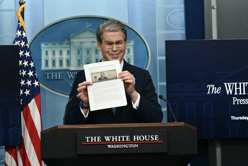 US Secretary of Treasury Scott Bessent shows a proposed $250 bill featuring President Donald Trump during a press briefing in the Brady Briefing Room of the White House in Washington, DC, on May 28, 2026. President Donald Trump could soon appear on a new $250 bill, in the Republican's latest move to shatter US traditions by putting his personal stamp on national institutions. A proposal for the new bill, featuring a glaring Trump, was first reported Thursday by the Washington Post. (Photo by Kent NISHIMURA / AFP via Getty Images)