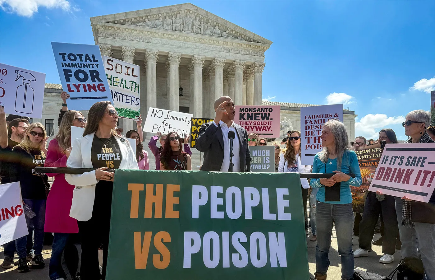 Sen. Cory Booker (D-NJ) addresses a rally in front of the U.S. Supreme Court in the case of Monsanto Company v. Durnell on April 27. (Sue Dorfman/ZUMA Press Wire via Newscom)