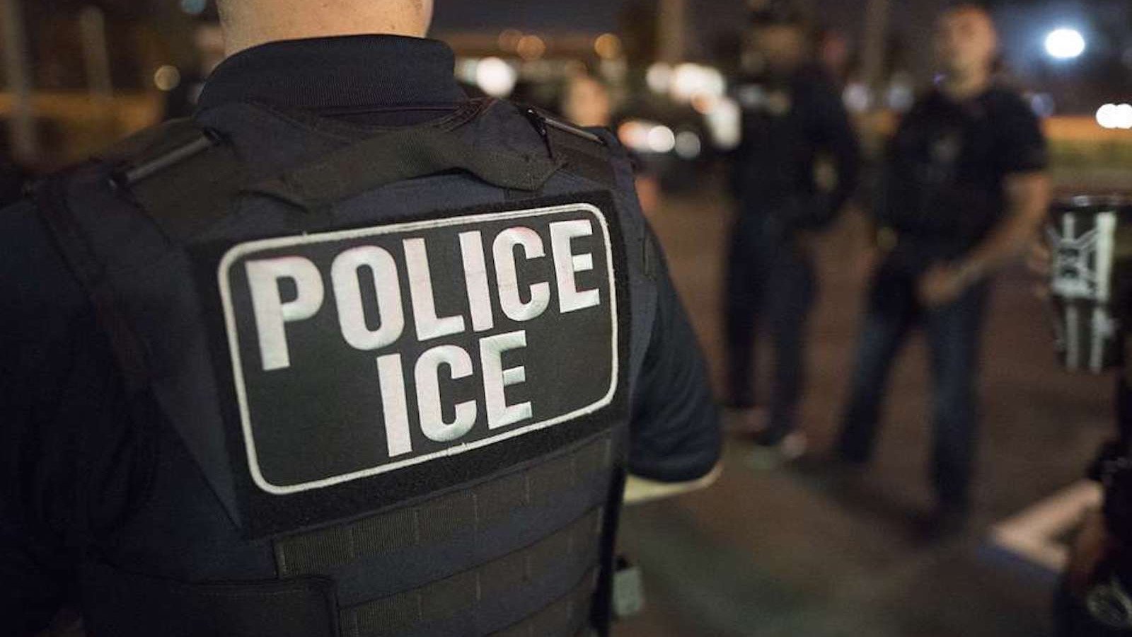 ICE enforcement agents conduct an immigration enforcement operation