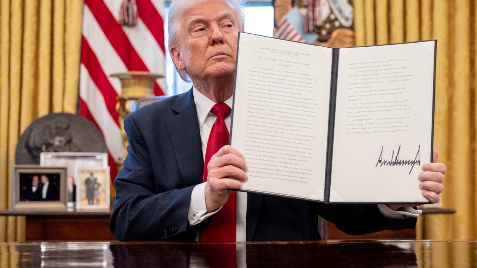 President Trump announces auto tariffs in the Oval Office.