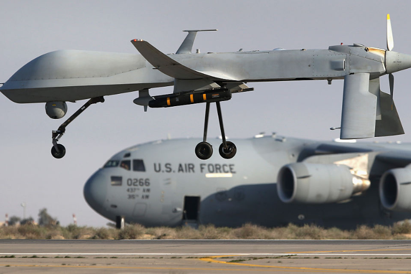 A U.S. Air Force MQ-1B Predator unmanned aerial vehicle (UAV), carrying a Hellfire air-to-surface missile lands at a secret air base in the Persian Gulf region on January 7, 2016. (Photo by John Moore/Getty Images)