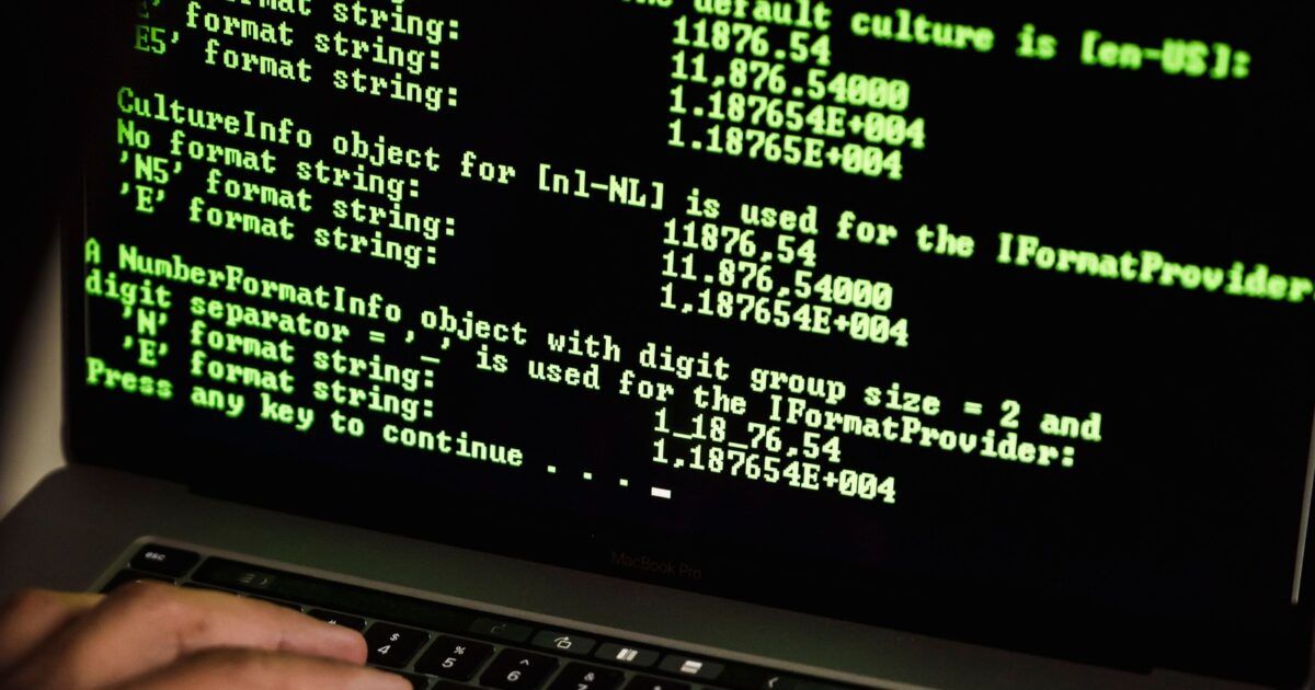 Real rights-safe Pexels photo of computer code on a laptop screen for an AI-assisted crypto security audit story.