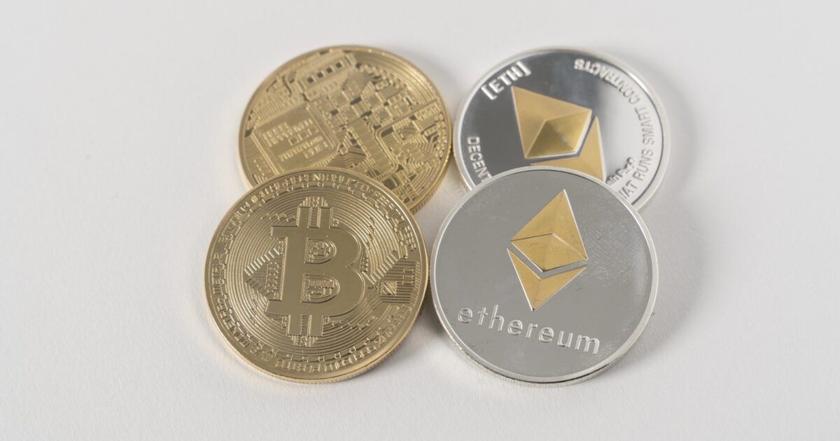 Physical cryptocurrency coins for a story about Bitcoin valuation and liquidity.
