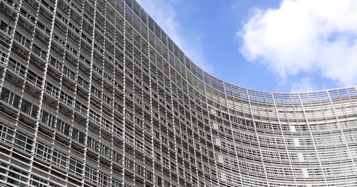 European Commission Berlaymont building in Brussels for a ProCoinNews article about MiCA 2.0 crypto regulation.