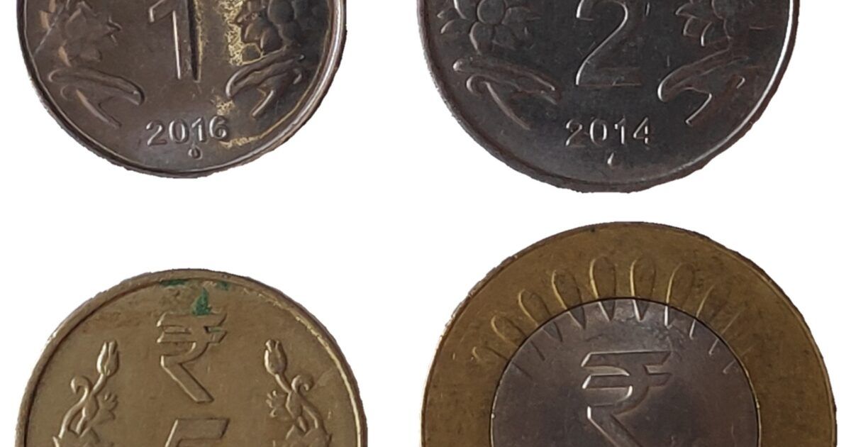 Indian rupee coins for a ProCoinNews article about USDT premiums in India.