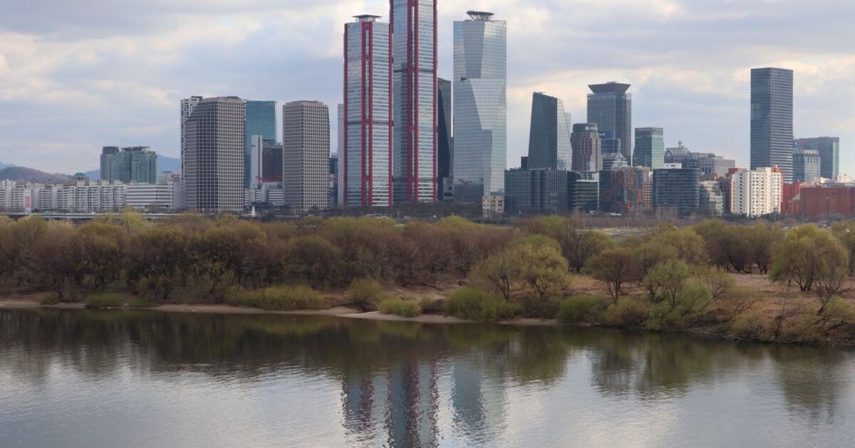 Seoul's Yeouido financial district for a ProCoinNews article about OKX AI and stablecoin payments for AI agents.