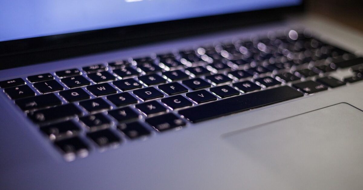 Backlit laptop keyboard for a ProCoinNews article about Phantom, Ventuals, and wallet-native perpetual futures.