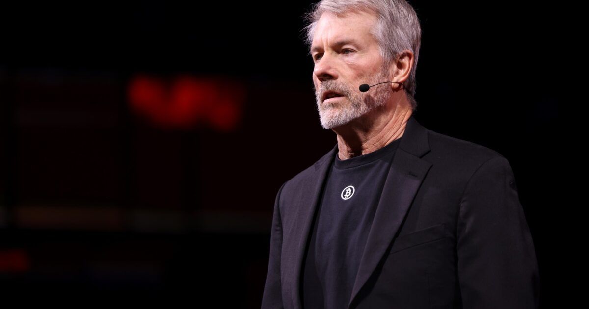 Michael Saylor speaking at a public event for a Strategy Bitcoin article.