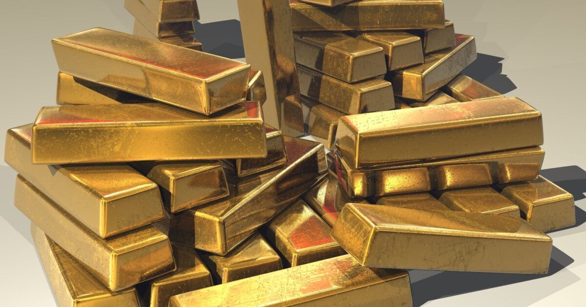 Gold bullion bars for a ProCoinNews article about Tether Gold and gold-backed lending.