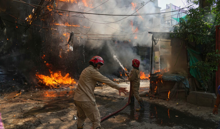 At least 21 people killed after fire sweeps through New Delhi building