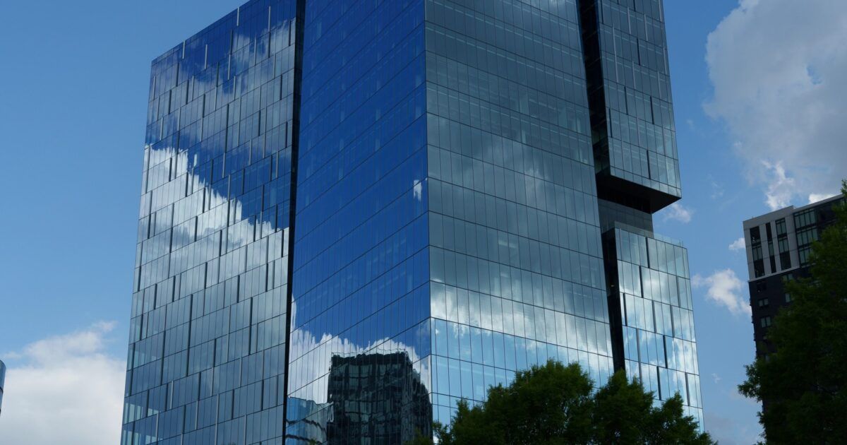Invesco Global Headquarters in Atlanta for a ProCoinNews article about Binance Wallet adding Plume's nBASIS vault.
