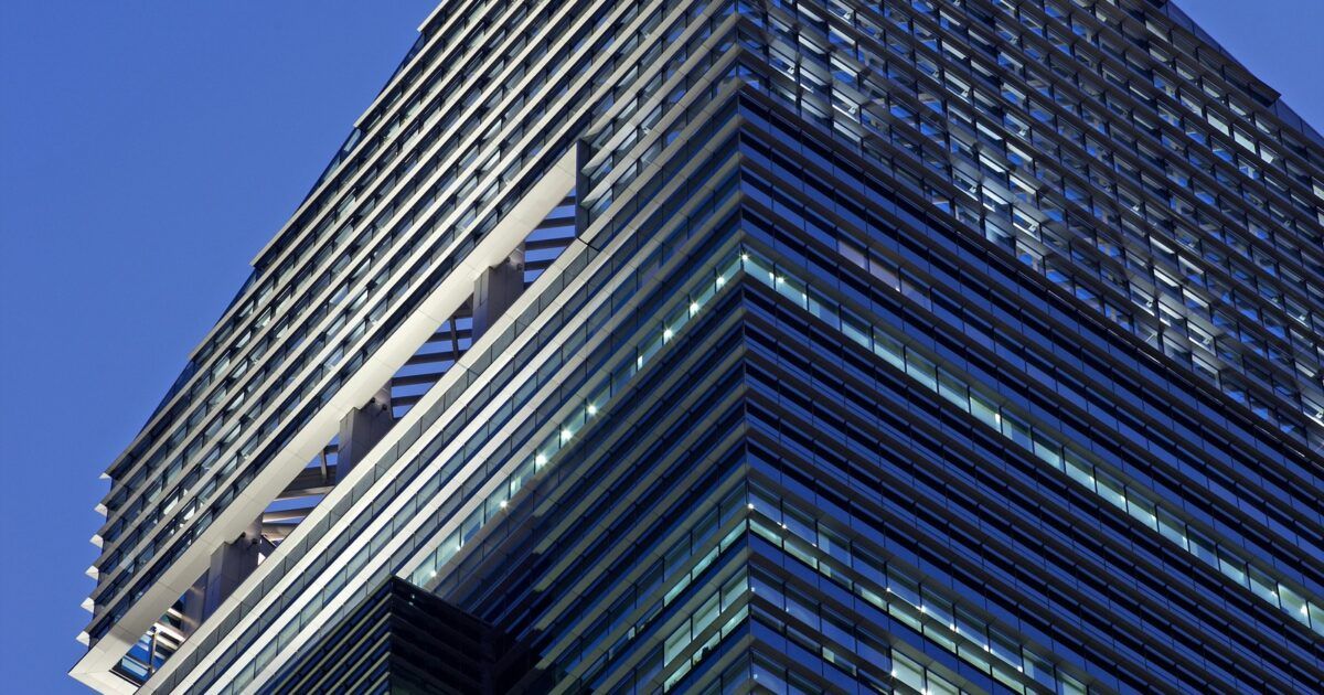 Standard Chartered skyscraper with bank logo for a ProCoinNews article about bank-led USDC minting and redemption.