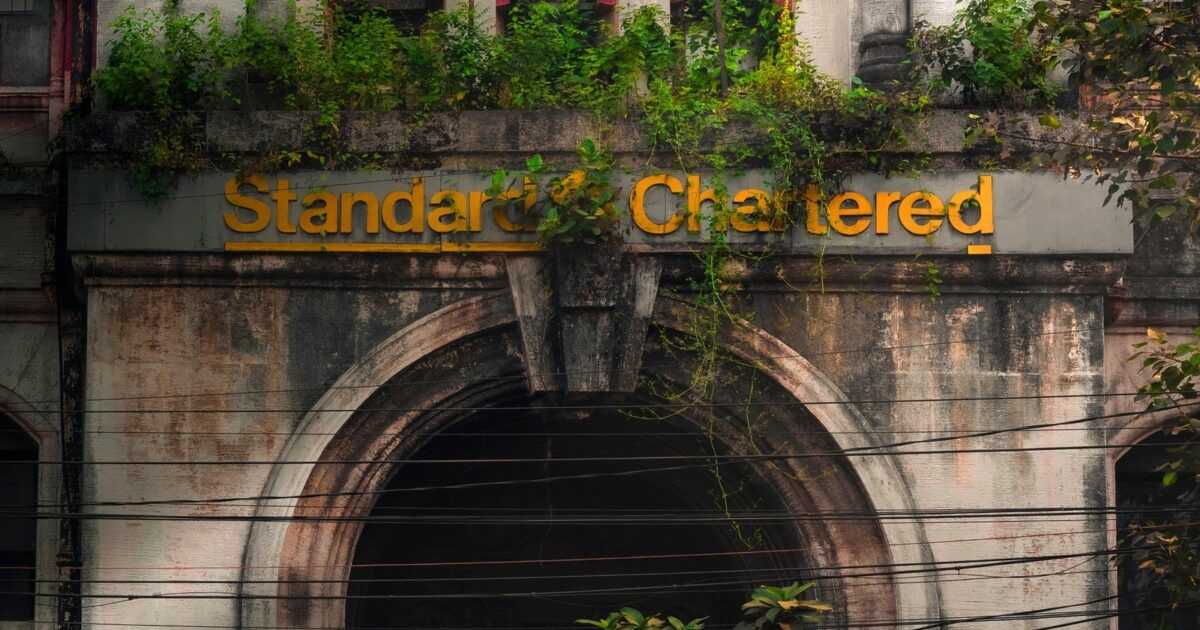 Standard Chartered building facade for a ProCoinNews article about the bank's Morpho DeFi lending thesis.