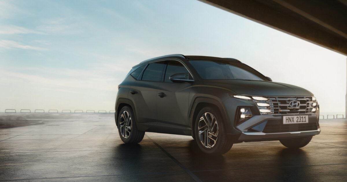 Hyundai Tucson beneath a bridge for an article about Hyundai's stablecoin treasury transfer pilot.