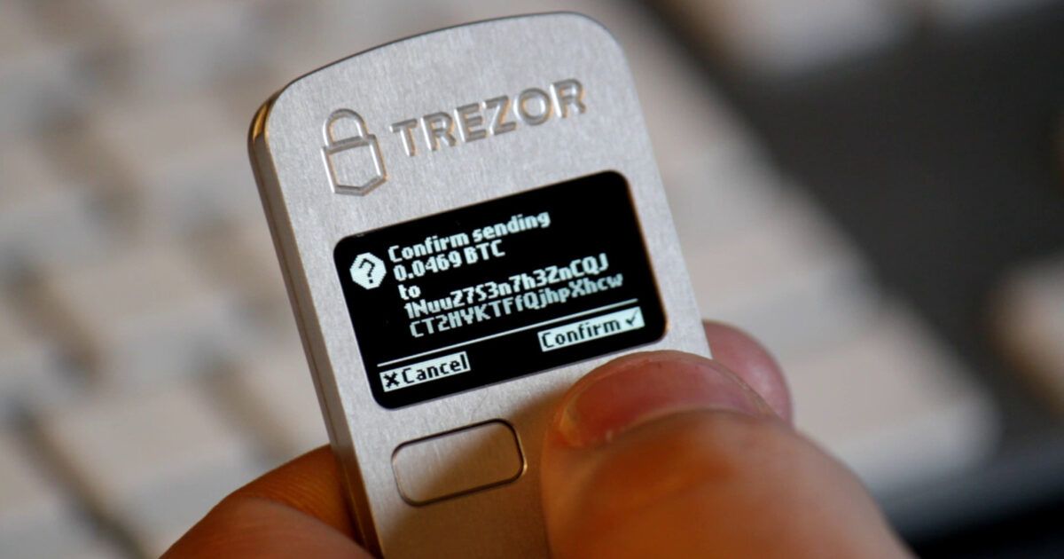 Trezor hardware wallet confirming a Bitcoin transaction