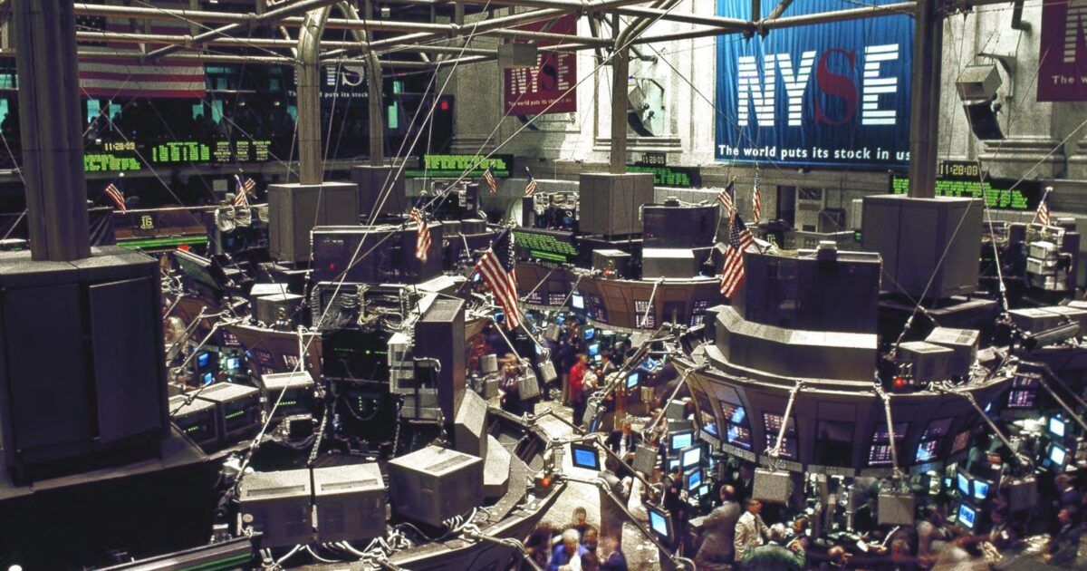 New York Stock Exchange trading floor as crypto ETF inflows accelerate