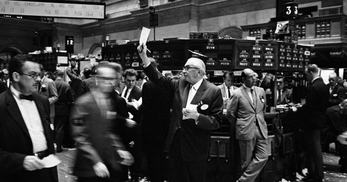 Traders working on the New York Stock Exchange floor in a public-domain archival photograph