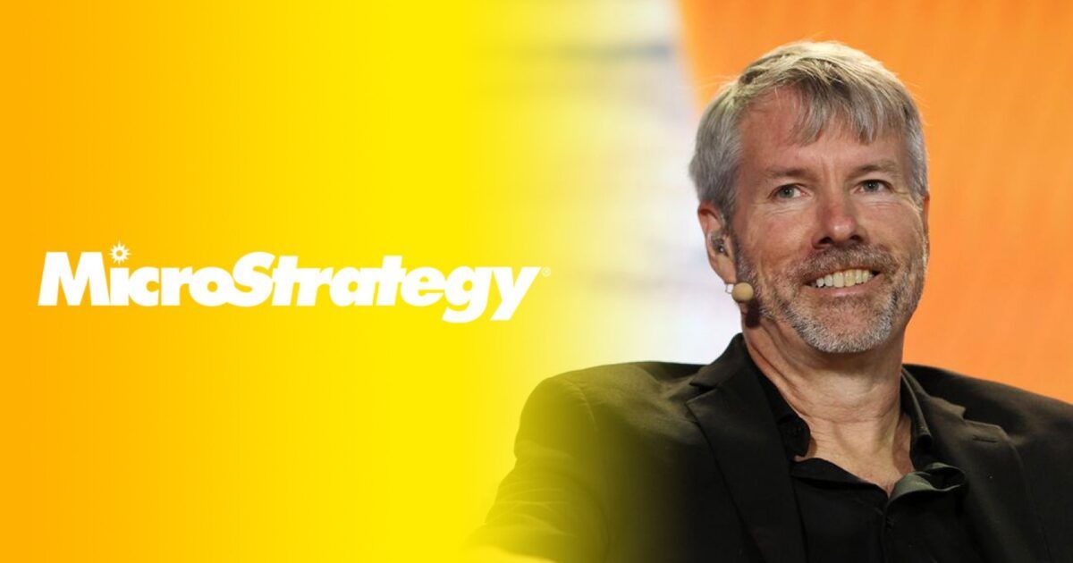 Michael Saylor against a yellow-orange MicroStrategy background