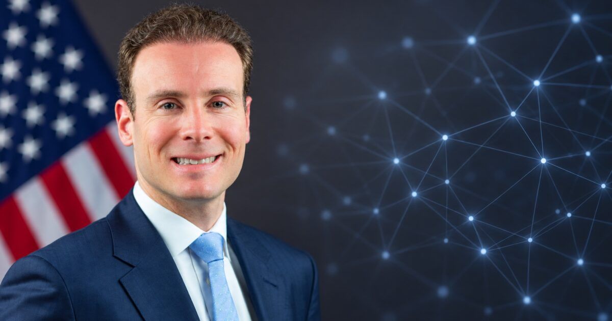 Official portrait of CFTC Chairman Michael Selig beside an abstract blockchain recordkeeping network