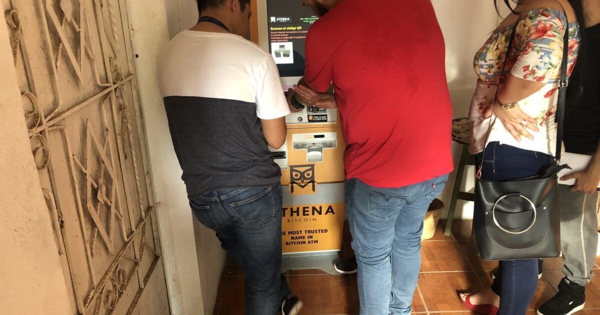 People using a Bitcoin ATM in El Salvador