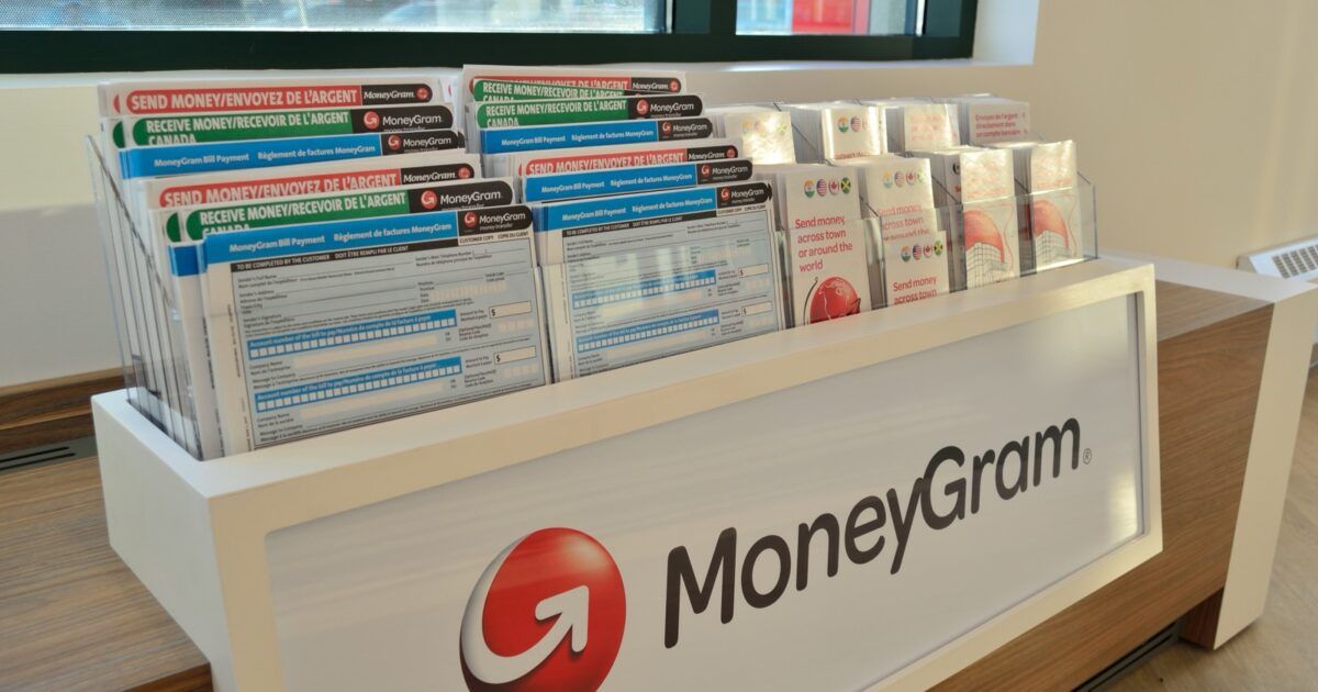 MoneyGram remittance counter illustrating local cash access for stablecoin payroll